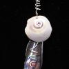 Shell, silver wire, silk cord